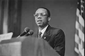 Jean-Bertrand Aristide, the former and future President of Haiti, delivers a luncheon address on June 28, 1994.