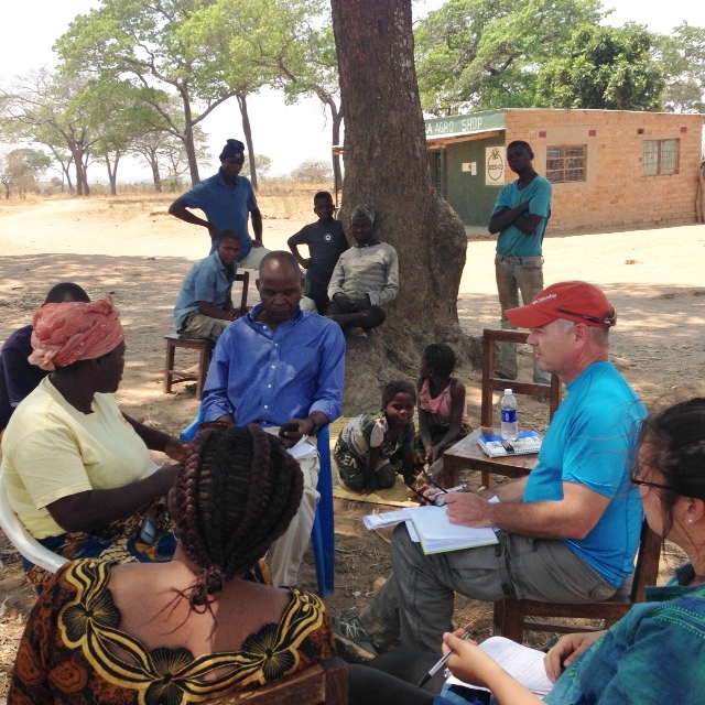 Edward DeMarco conducting meeting in a Zambia village.
