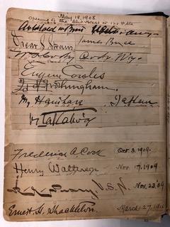 Photo of autograph book from 1909 Club event about North Pole exploration.