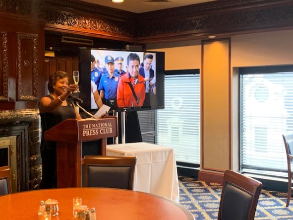 Photo of Club President Lisa Matthews toasting Maria Ressa's Nobel Prize win.