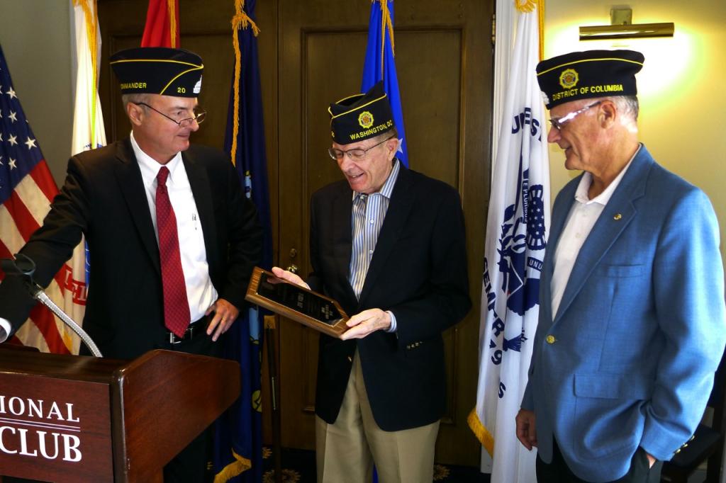 Photo of former American Legion Post 20 leader Jim Noone receiving a plaque for his service.